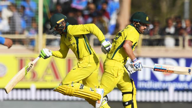 Aaron Finch (R) and Usman Khawaja piled on a massive opening partnership. Picture: Dibyangshu Sarkar/AFP