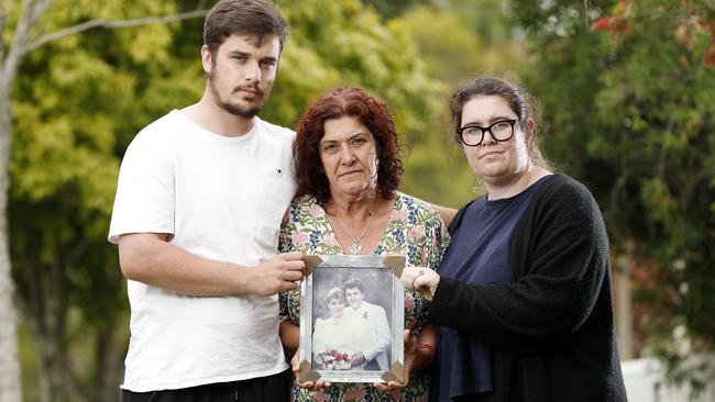 Riley, Anita and Jessica Warburton pictured outside their home in Brisbane. Picture: Josh Woning