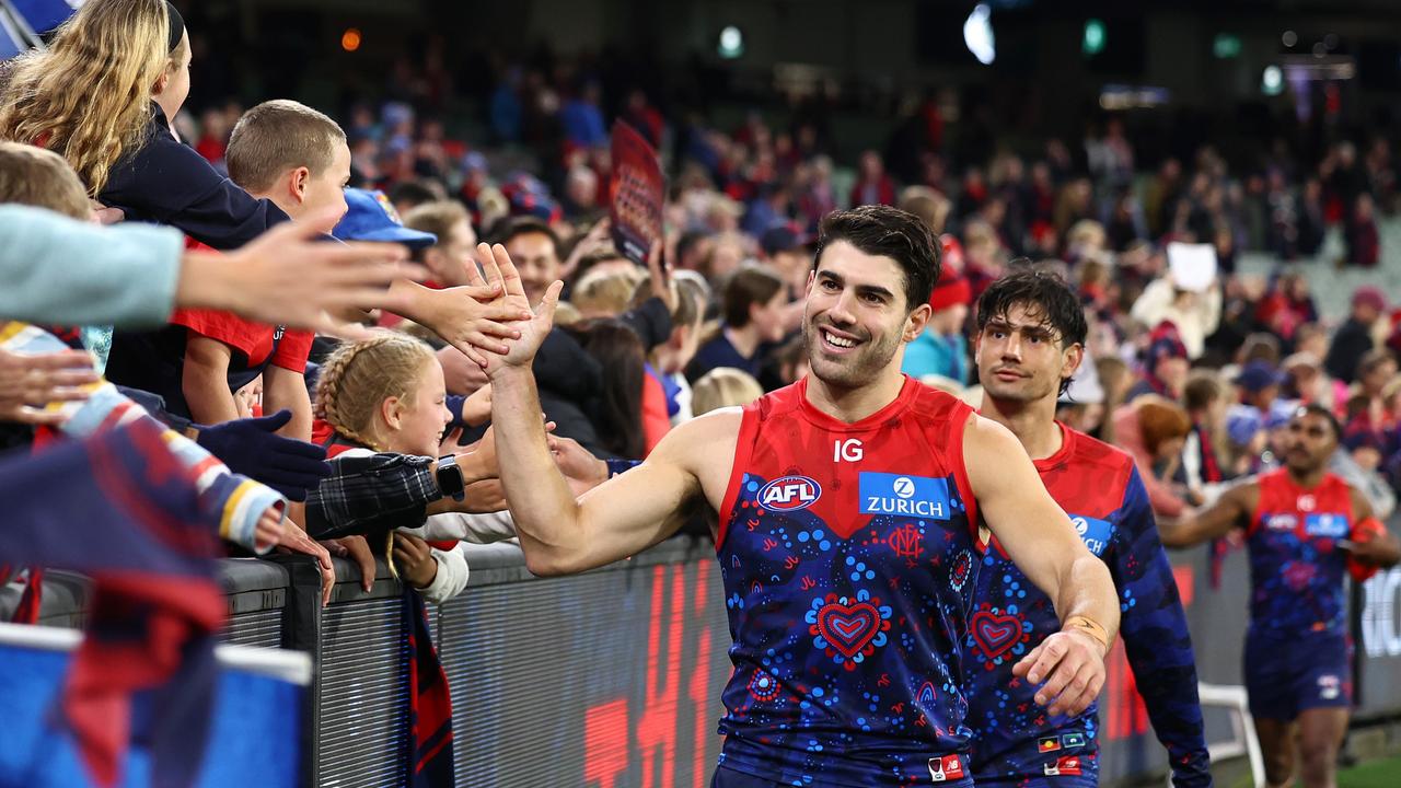 MELBOURNE, AUSTRALIA - MAY 26: Christian Petracca of the Demons high fives fans after winning the round 11 AFL match between Narrm (the Melbourne Demons) v Euro-Yroke (the St Kilda Saints) at Melbourne Cricket Ground, on May 26, 2024, in Melbourne, Australia. (Photo by Quinn Rooney/Getty Images)