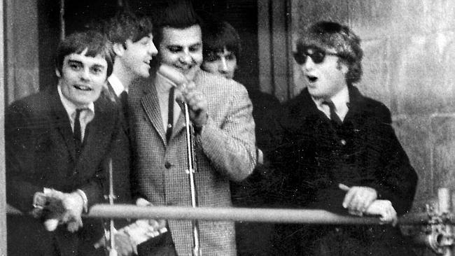 Bob Francis, centre, on the Adelaide Town Hall balcony with The Beatles, from left, stand-in drummer Jimmy Nicol, Paul McCartney, George Harrison and John Lennon, on June 12, 1964.