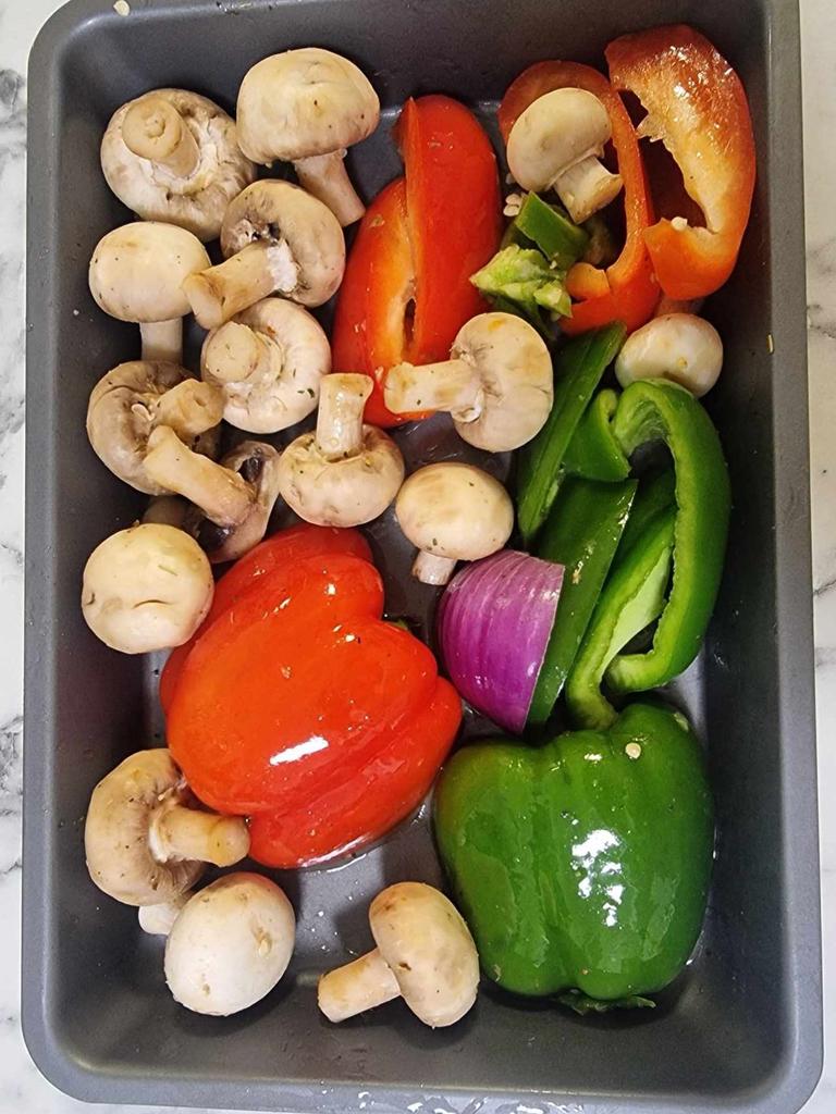 Cooking vegetables in the Ooni Karu 12G pizza oven. Picture: Tahnee-Jae Lopez-Vito/news.com.au.