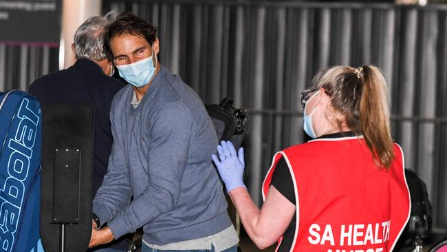 Rafael Nadal gets a wave from a nurse as he arrives. Picture: Brenton Edwards/ AFP