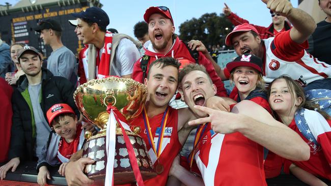 Jake Wohling and Cal Wilkie celebrate with fans after the 2018 SANFL decider. Picture: AAP Image/Dean Martin.