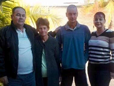 (L to R) Lance Mills, Dawn Mills, and their children John Mills and Marie Mills. This photo was taken after the men had played golf while "mum and (Marie) were the caddies."