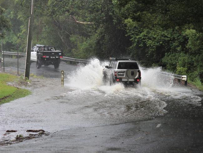 The torrential rain on the Mid North Coast has caused minor flooding across the region. In Upper Orara some roads are already being inundated with water. Photo: Tim Jarrett