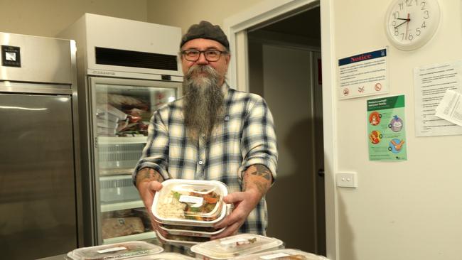 Stephen Barrington with takeaway meals. Picture: Hamish Blair