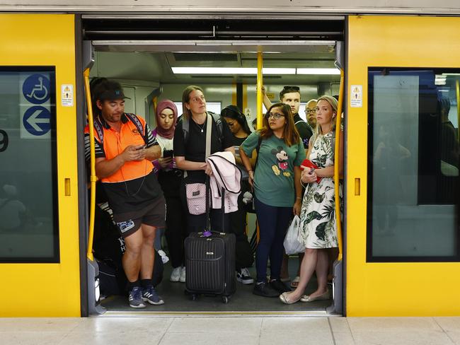 DAILY TELEGRAPH 8TH MARCH 2023Pictured are commuters waiting patiently for a delayed train to leave the platform at Central Station in Sydney. Commuters experienced big delays after the entire train system went down for an hour at 3.30pm.Picture: Richard Dobson