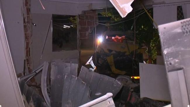 A car has crashed into a house in Perth narrowly missing a sleeping father. Picture: Nine News