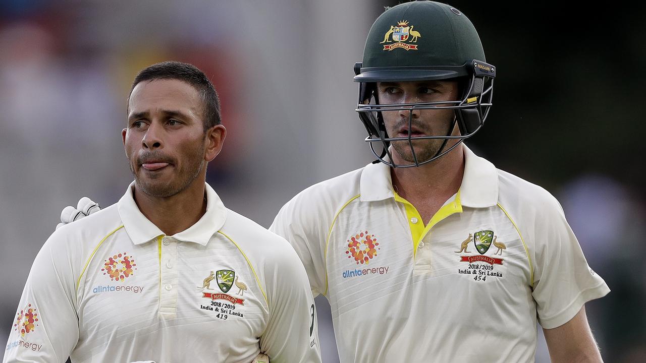 Australia's batsmen Usman Khawaja and Travis Head.