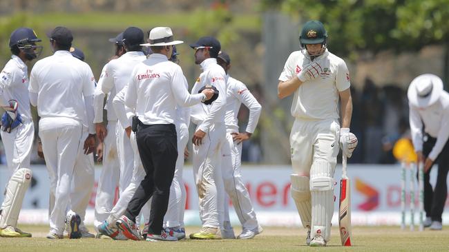 Australia's Adam Voges leaves the field after being dismissed in Galle.