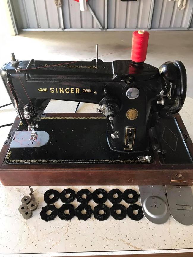 This vintage 1955 Singer sewing machine (model 306k) comes complete with all attachments.