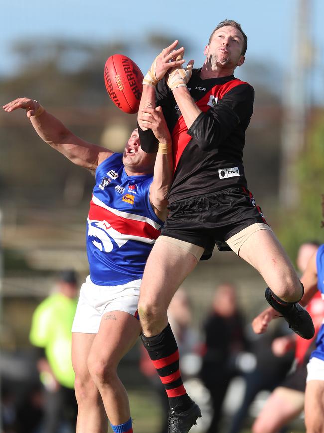 Waaia’s Ash Holland and Strathmerton’s Darcy Robinson battle for a mark.