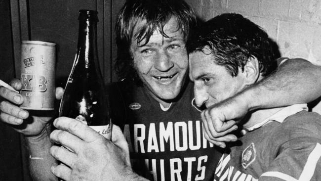 Ken Wilson celebrates a win with Newtown teammate Tommy Raudonikis.