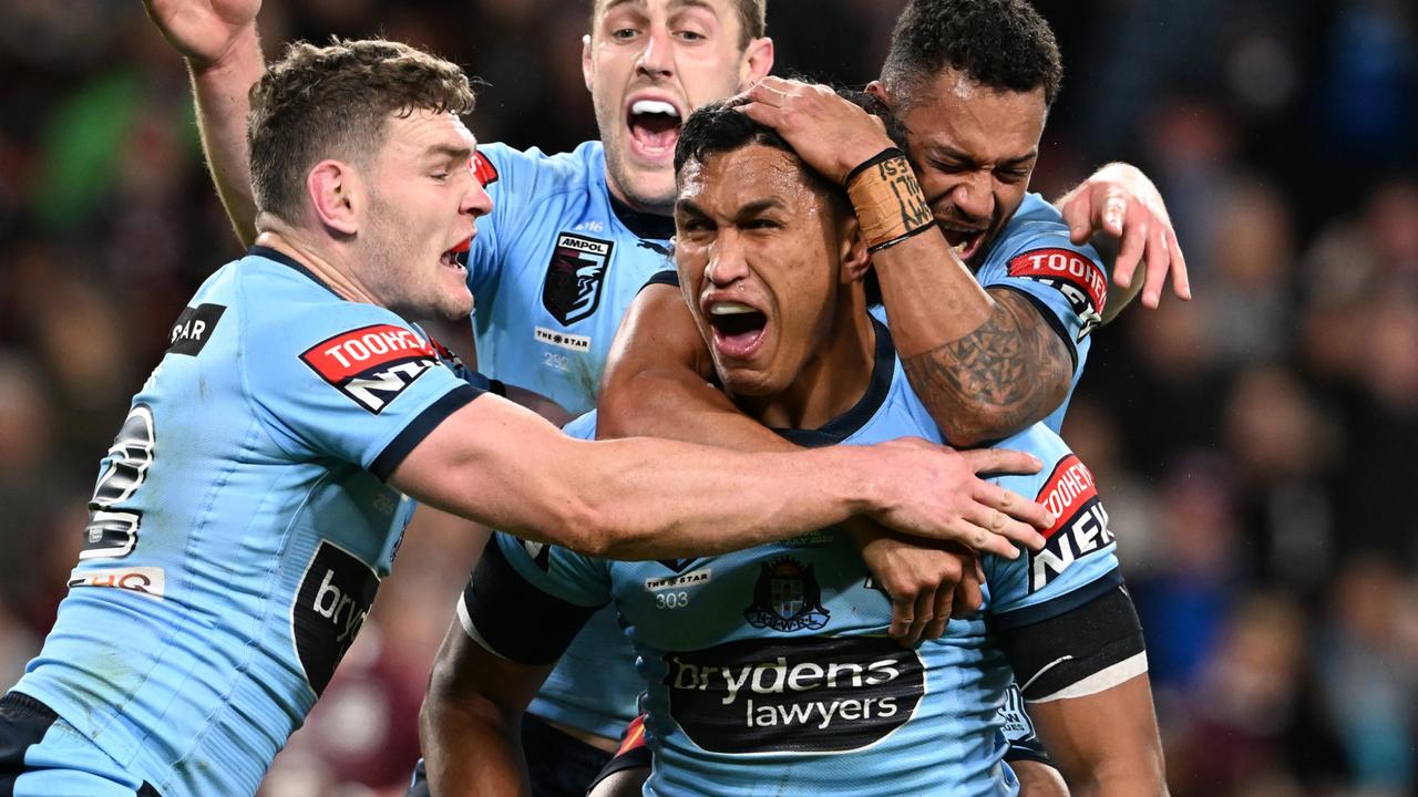 BRISBANE, AUSTRALIA - JULY 13: Jacob Saifiti of the Blues celebrates with teammates after scoring a try during game three of the State of Origin Series between the Queensland Maroons and the New South Wales Blues at Suncorp Stadium on July 13, 2022 in Brisbane, Australia. (Photo by Bradley Kanaris/Getty Images)