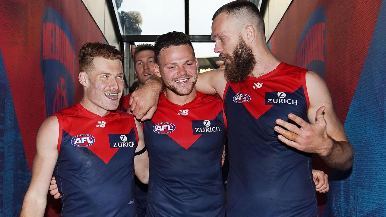 Demons Oskar Baker, Steven May and Max Gawn after a big win. Picture: Michael Dodge/Getty Images