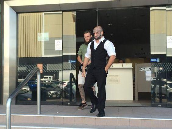 Nathan Leonard Richards, wearing a vest and with face tattoos, walks from Maroochydore District Court after being given immediate parole for an attack on a security guard at Kawana Shoppingworld. . Picture: Stuart Cumming