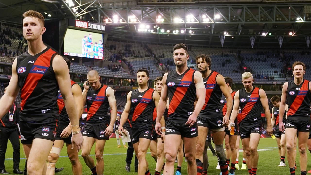 Dejected Bombers players leave Marvel Stadium after their massive loss to the Western Bulldogs. Pic: AAP