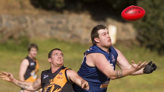 Daniel Nelson for Tigers and Miels Grice for Coolaroo, Coolaroo v Toowoomba Tigers, AFL Darling Downs qualifying final at Gold Park, Saturday, August 31, 2013. Photo Kevin Farmer / The Chronicle