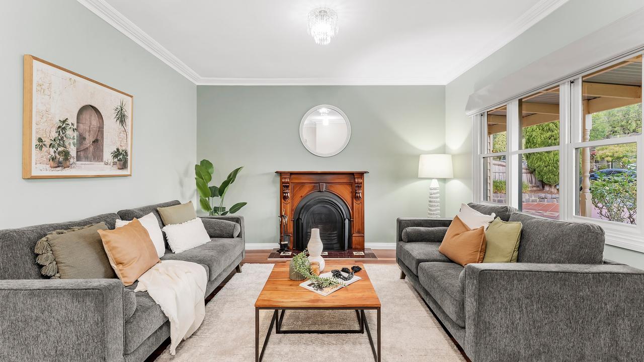 An open fireplace in one of the three living areas.