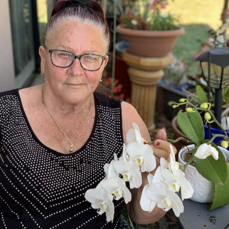 Glenella mum Robyn 'Robbi' Mapley has honoured former workmate Brendan Moreland in a heartfelt tribute following his shock death on Tuesday. She tenderly cradles an orchid he gifted her about 12 months ago before she went into hospital.