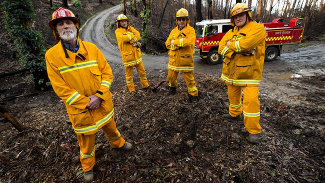 (L-R) Wye River CFA captain Roy Moriarty, Max McCaffrey,Rex Brown, Michael Winn (in truck) and Tony Maly back former minister Jane Garrett. Picture: Norm Oorloff