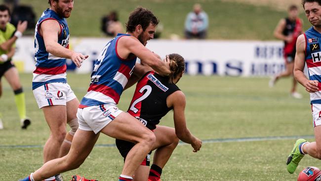 Central’s Jydon Neagle battles West’s Kenneth Karpany at Elizabeth Oval on Saturday. Picture: AAP Image/ Morgan Sette