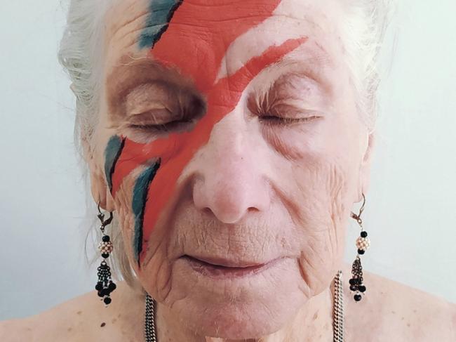 Residents at a UK aged care home have been recreating classic album covers as a way to keep themselves entertained during lockdowns., Albums by David Bowie, Adele, the Clash among others have been creatively reimagined by the residents and staff at Sydmar Lodge Care Home in Edgware in North London which has been closed to visitors since March 12.  Roma Cohen and David Bowie.  Picture: @robertspeker / Sydmar Lodge