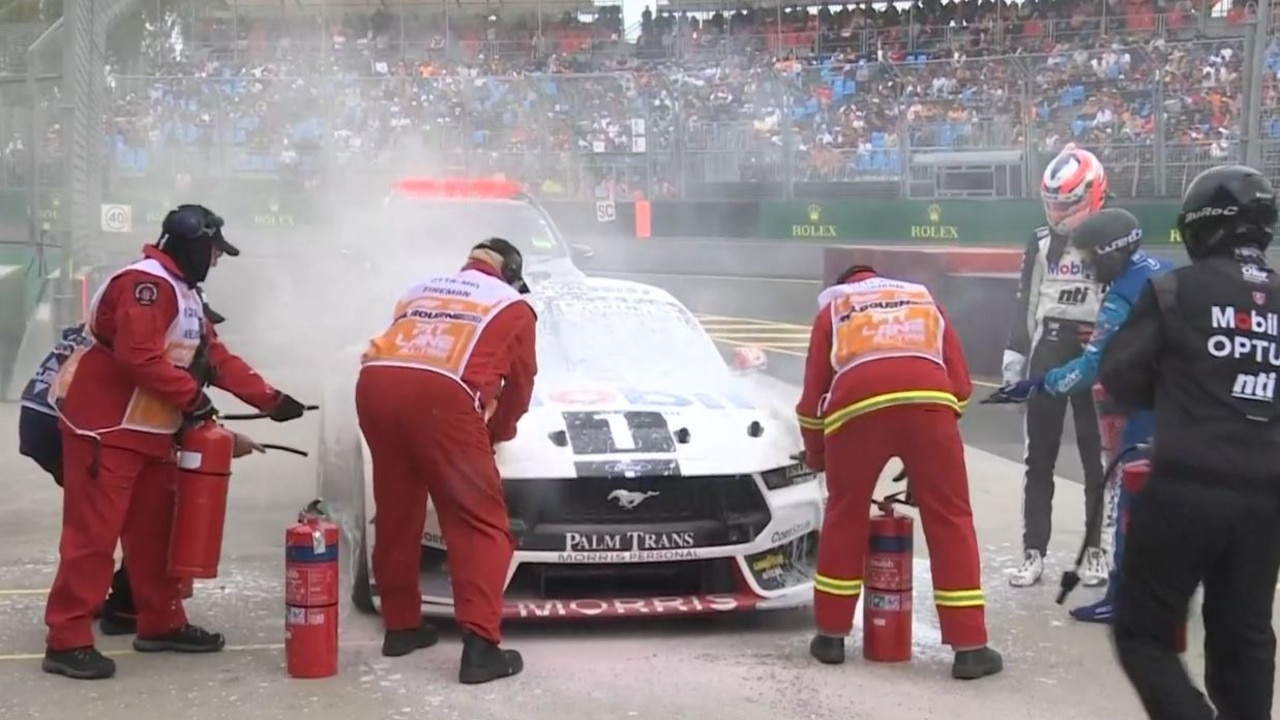 Fire extinguishers are used to put of the fire in Nick Percat's Mustang.