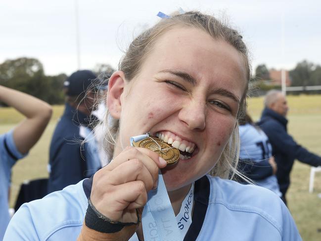 CHS1's Charlie Norton with her medal. Girls Rugby Sevens Grand Final. CHS1 (light blue) v CCC1 (dark blue). Action from game. Junior Rugby. NSW Schools Rugby union trials at Eric Tweedale Oval. Picture: John Appleyard