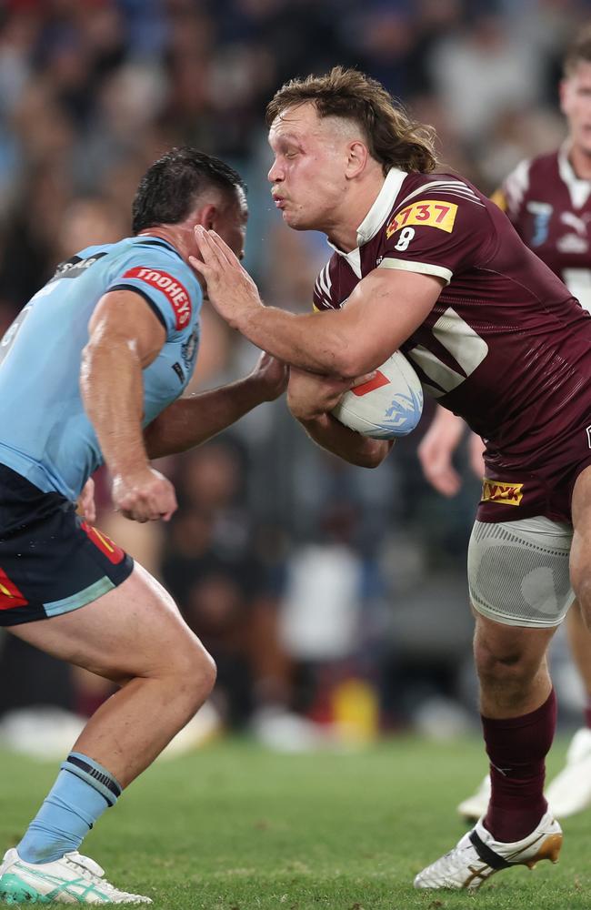 Reuben Cotter is tackled during game one of the 2024 Men's State of Origin Series. (Photo by Matt King/Getty Images)