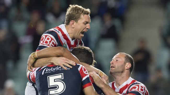 Mitchell Aubusson (left) and Boyd Cordner of the Roosters celebrate try and match winner by Latrell Mitchell during the NRL qualifying final between the Sydney Roosters and the Brisbane Broncos at Allianz Stadium in Sydney, Friday, September 8, 2017. (AAP Image/Craig Golding) NO ARCHIVING, EDITORIAL USE ONLY