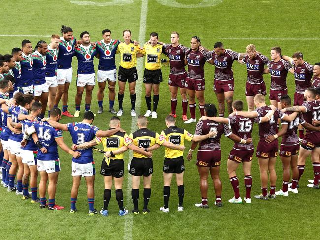 Teams stand for a minutes silence for the Christchurch terror victims during the Round 3 NRL match between the Manly Sea Eagles and New Zealand Warriors at Christchurch Stadium in Christchurch, New Zealand, Saturday, March 30, 2019. (AAP Image/Martin Hunter) NO ARCHIVING, EDITORIAL USE ONLY