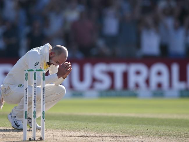 Australia's Nathan Lyon reacts after being hit for 6 by England's Ben Stokes on the fourth day of the 3rd Ashes Test cricket match between England and Australia at Headingley cricket ground in Leeds, England, Sunday, Aug. 25, 2019. (AP Photo/Jon Super)