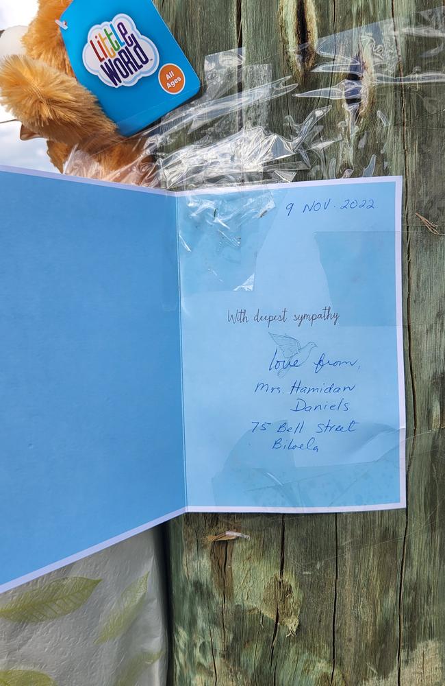 Tributes in the form of cards, flowers and teddy bears have been left on a light pole where the crash happened.