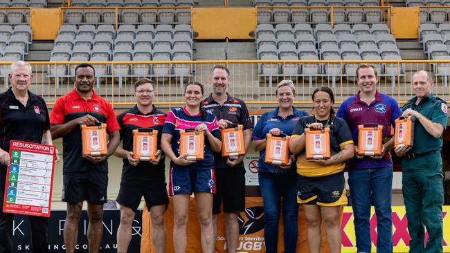 Colin Southam, Sete Cakaunivalu, Robert Butcher, Dailene Doyle, Matt Kaye, Annette Blunt, Jordan Lewis, Rhys Morcom and Geoff Bates with AEDs ahead of the 2024-25 Darwin Rugby grand finals. Picture: Pema Tamang Pakhrin