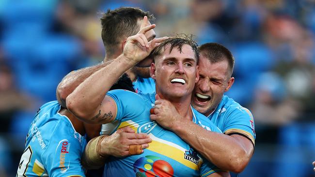 GOLD COAST, AUSTRALIA - MAY 12: AJ Brimson of the Titans celebrates a try during the round 10 NRL match between Gold Coast Titans and North Queensland Cowboys at Cbus Super Stadium, on May 12, 2024, in Gold Coast, Australia. (Photo by Chris Hyde/Getty Images)