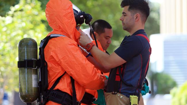 A firefighter is suited up after suspicious packages were found. Picture: Aaron Francis