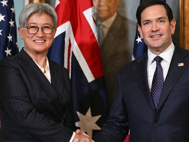 US Secretary of State Marco Rubio and Australian Foreign Minister Penny Wong shake hands as they meet at the State Department in Washington, DC, on January 21, 2025. (Photo by ANDREW CABALLERO-REYNOLDS / AFP)