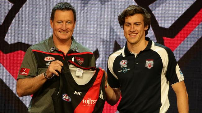 Number one draft pick Andrew McGrath with Essendon Senior Coach John Worsfold pictured at the 2016 AFL Draft.