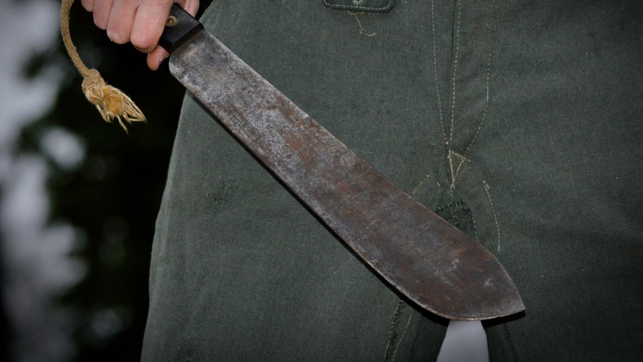 Man attacked by machete-wielding trio