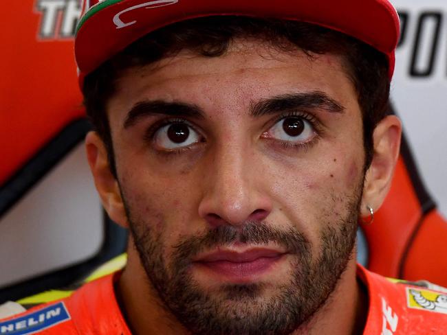 Ducati Team's Italian rider Andrea Iannone looks on in his pit during the first practise session at the Marco Simoncelli Circuit of the San Marino Moto GP Grand Prix race in Misano, on September 9, 2016. / AFP PHOTO / GABRIEL BOUYS