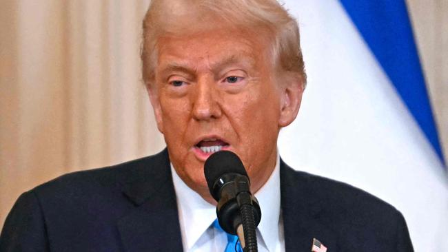 US President Donald Trump during a press conference with unseen Israel's Prime Minister Benjamin Netanyahu in the East Room of the White House in Washington, DC, on February 4, 2025. (Photo by Jim WATSON / AFP)