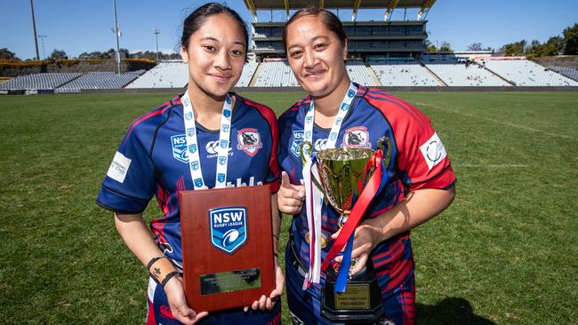 Tetuanui Dean (right) celebrates the Collegians premiership with teammate and daughter, Briana Dean, 11th September 2022. News Local, pictures by Julian Andrews.