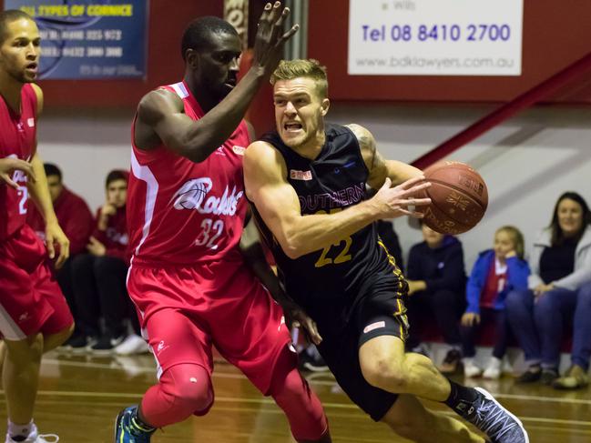 North Adelaide’s now two-time Woollacott Medallist, Alex Starling, guarding Southern Tigers player Rob Linton last year. Picture: Rod Patterson.