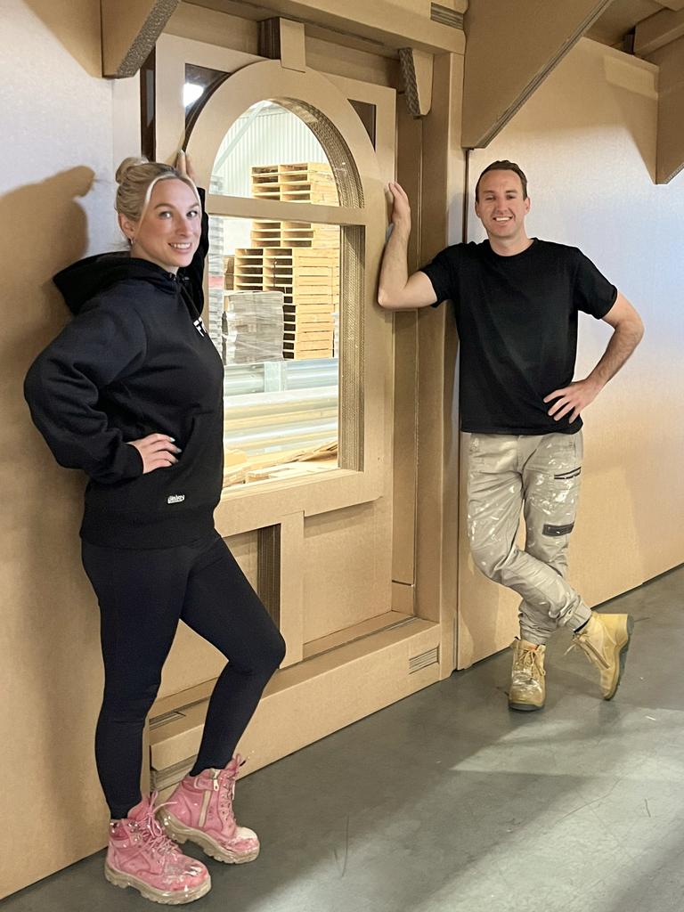 Jesse Raeburn and Mel Manson from The Block with their cardboard house by Enphase solar, which they’ll be showcasing at the All Energy expo in Melbourne