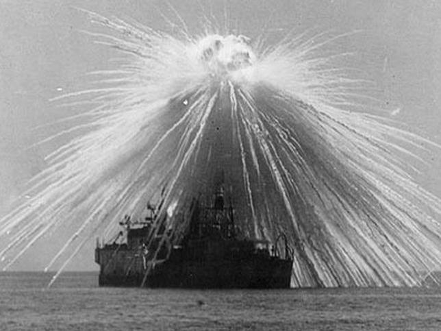 A phosphorus bomb explodes above USS Alabama during Billy Mitchell's bombing demonstrations in 1921. Picture: Supplied.