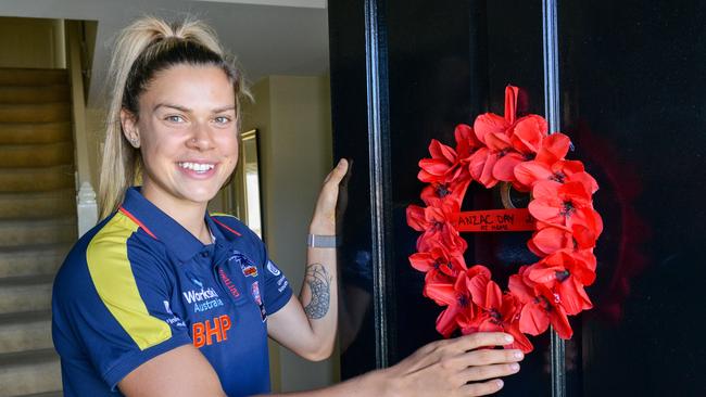 Crows midfielder Anne Hatchard at home preparing for Anzac Day. She is joining the air force in June. Picture: Brenton Edwards