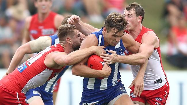 Shaun Higgins tries to break through a tackle duing North Melbourne’s pre-season win over Sydney. Picture: Getty Images