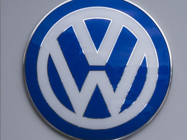 The Volkswagen logo is seen at a Volkswagen dealer in Berlin on September 22, 2015. In an affair that originally broke on Friday and has unfolded rapidly since then, VW has forced to admit on Tuesday that 11 million of its diesel cars all around the world are equipped with devices that can cheat pollution test. AFP PHOTO / ODD ANDERSEN