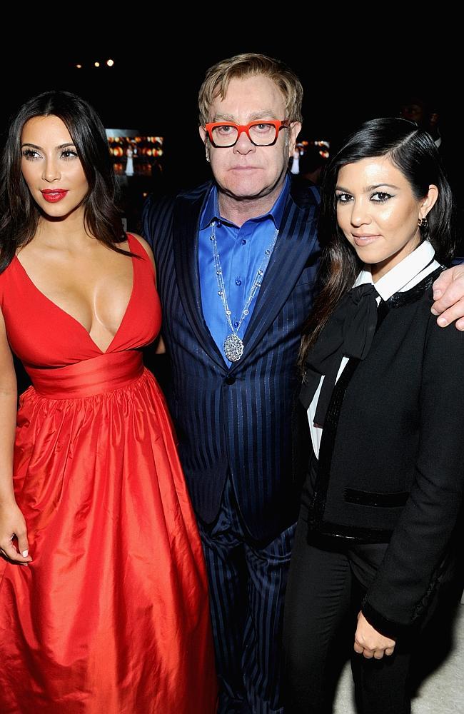 Kim Kardashian, Sir Elton John and Kourtney Kardashian attend the 22nd Annual Elton John AIDS Foundation Academy Awards Viewing Party at The City of West Hollywood Park on March 2, 2014 in West Hollywood, California.